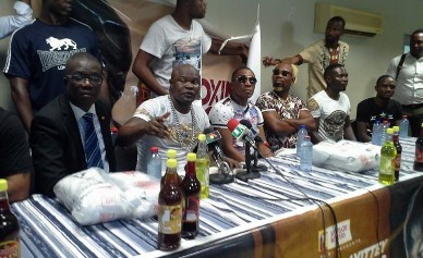 Banku and Powers at a press conference