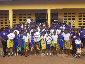 The female staff of EXP Ghana with some school girls
