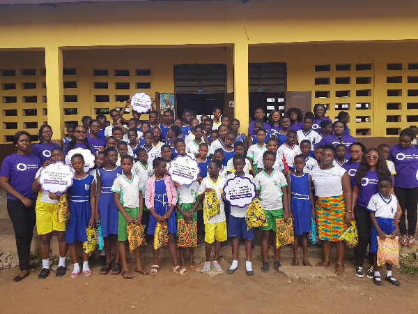 The female staff of EXP Ghana with some school girls