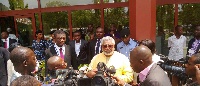Former President, Jerry John Rawlings talking to the media, looking on are some NDC executives.