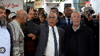 Supporters of the Tunisian Islamist movement Ennahda, with Noureddine Bhiri, second right, stage a p