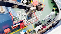 Health workers get off the Dutch-flagged MV Hondius cruise ship as it remains off Cape Verde