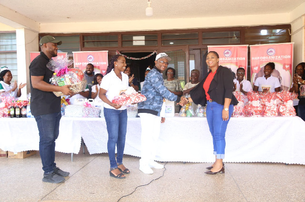 Bishop Dr. Charles Cofie Hackman presenting the items to officials of the hospital