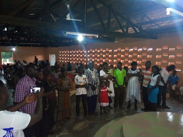 Family members of the slain men at the church service