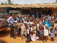 Kids of Potter's Village with Stanbic Bank officials