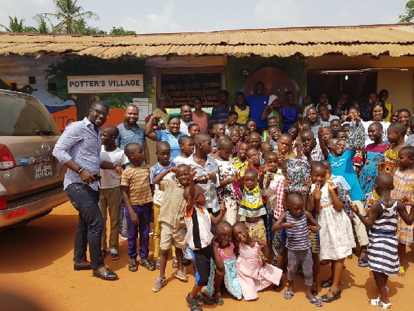 Kids of Potter's Village with Stanbic Bank officials