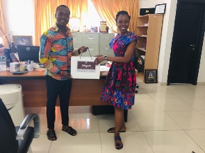 Prof Kaufmann receiving a gift from the CEO of Obuobi Mpaboa