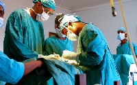 Doctors performing a surgical procedure
