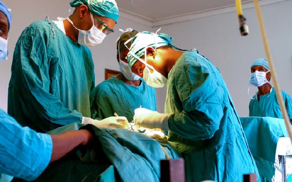 Doctors performing a surgical procedure