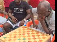 The IGP, Dr. George Akuffo Dampare playing draughts with some persons