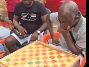 The IGP, Dr. George Akuffo Dampare playing draughts with some persons