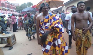 Chief fetish priest Nana Kofi Adjei clad in Kente