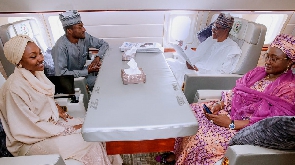 Buhari, wife Aisha and their two kids Yusuf and Hanan aboard the presidential jet