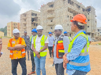 Martin Adjei-Mensah Korsah (middle from right) at a building site