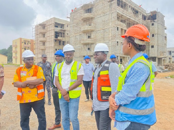 Martin Adjei-Mensah Korsah (middle from right) at a building site