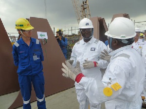 FPSO Mr Charles Darko (L) In A Tete A Tete With Energy Minister And Mr Wan Of Jurong