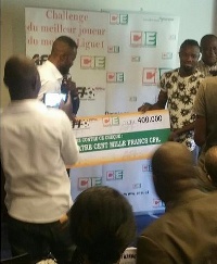 Baffour Asare receiving the dummy cheque