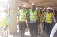 Minister (2nd L), consultant, Joe Hackman (L) and other technical workers