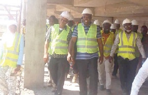 Minister (2nd L), consultant, Joe Hackman (L) and other technical workers