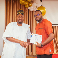 Carl receiving a certificate of excellence from the Festival Director