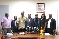 Member of the committee in a pose with the Minister for Health