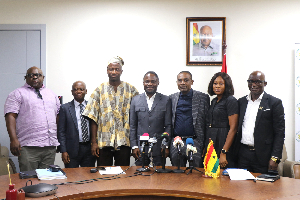 Member of the committee in a pose with the Minister for Health