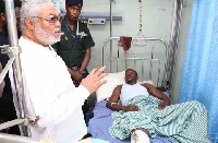 Former President Jerry John Rawlings with one of the victims of the Ayawaso by-election shooting