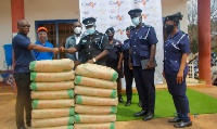 The company presenting bags of cement to the Airforce Base in Takoradi