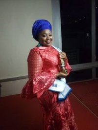 Mrs Abiola Bawuah holding her award