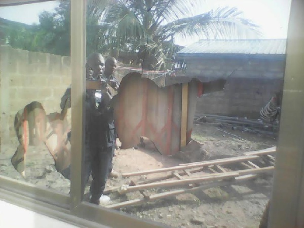 Police at the site of the demolition