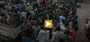 M23 rebels escort government soldiers and police who surrendered