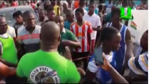 Angry voters confronting some polling officials at the Bukom center