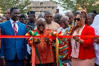 Akuf-Addo flanked by Adwoa Safo and Education Minister as he cuts tape for model school