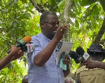 Frank Annor-Dompreh engaging cocoa farrmers at New Edubiase