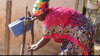An image of a woman washing her hands