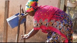 An image of a woman washing her hands