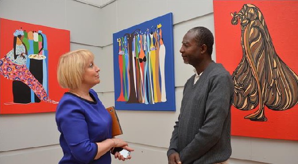 Larry Otoo exchanging pleasantries with a participant