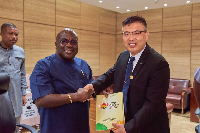 Julius Debrah (L) had a business engagement with China’s Chen Xiaowei (R)