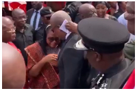President Mahama comforting the woman during the event