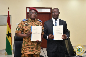 Major General Célestin Simporé (L) with Dr Cassiel Ato Forson (R)