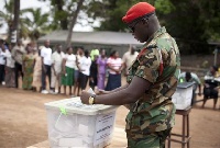 File photo: A military personnel casting his vote