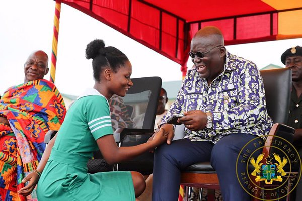 President Akufo-Addo exchanging pleasantries with a nurse during the restoration of nurses allowance