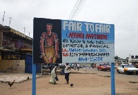 Sign post advertising a spiritual healer who offers help for both spiritual & physical issues