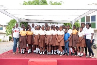 Executives of Airtel STEM with some pupils at Ablekuma central circuit