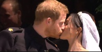 Prince Harry and Meghan share a kiss on the steps outside St George's Chapel