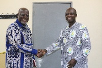 Hon. Hackman Owusu Agyemang, Board Chairman of COCOBOD in a hand-shake with Dr. Albert Benneh