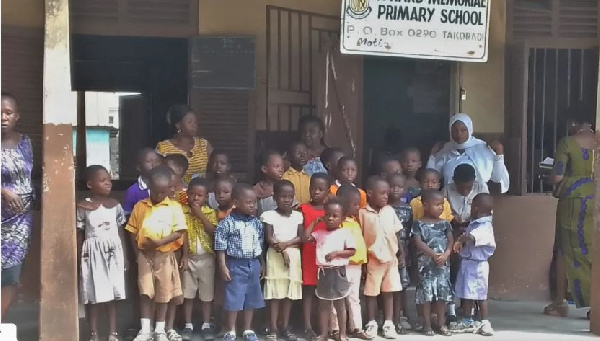 Some students and staff at Mbredene M/A, Kweikuma