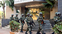 Soldiers from the presidential guard patrol outside the Radisson Blu hotel in Bamako