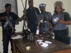 Police With Seized Weapons