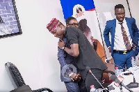 Nana Appiah Mensah hugging Stonebwoy